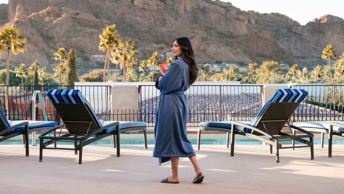 Woman in spa robe on the terrace.