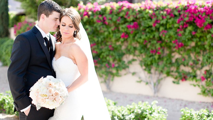 Happy couple posing for a picture.