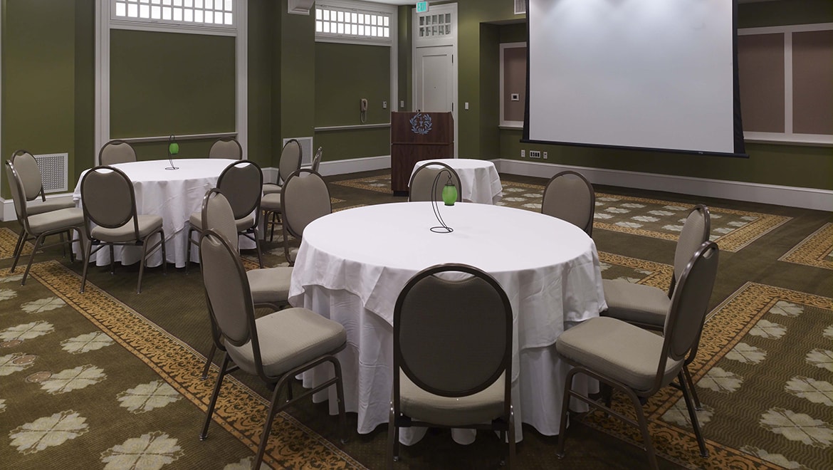 Meetings space with banquet tables.