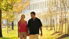 Couple walking through the park in Bedford Springs