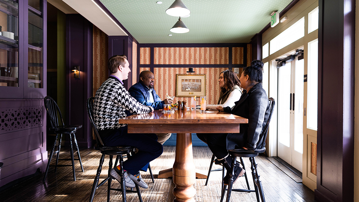 People dining at table.