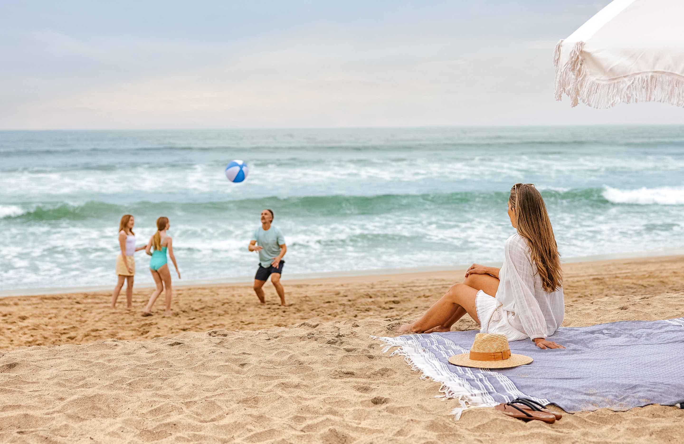 Family playing at the beach.