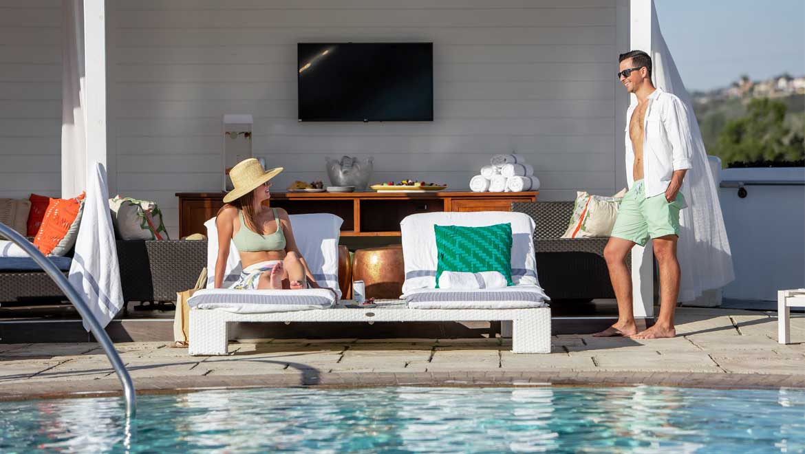 Couple in a cabana by the pool