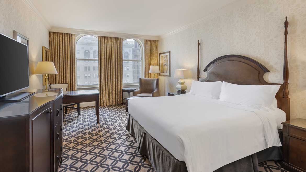 King room with large windows.