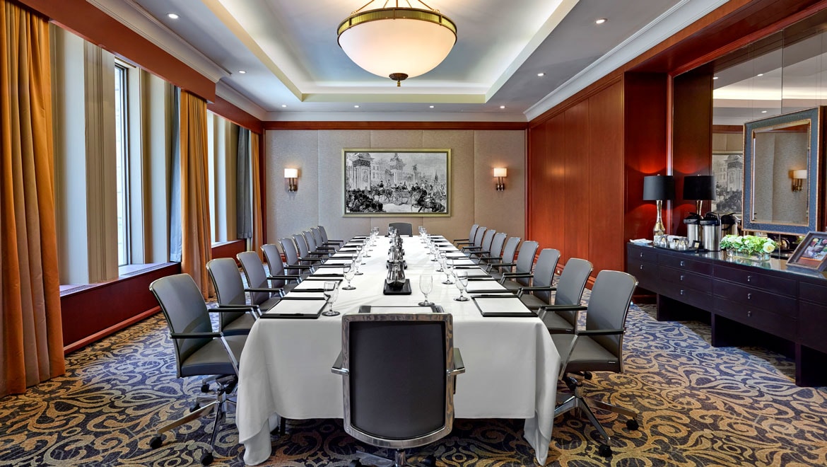 Meeting room set up with boardroom table.