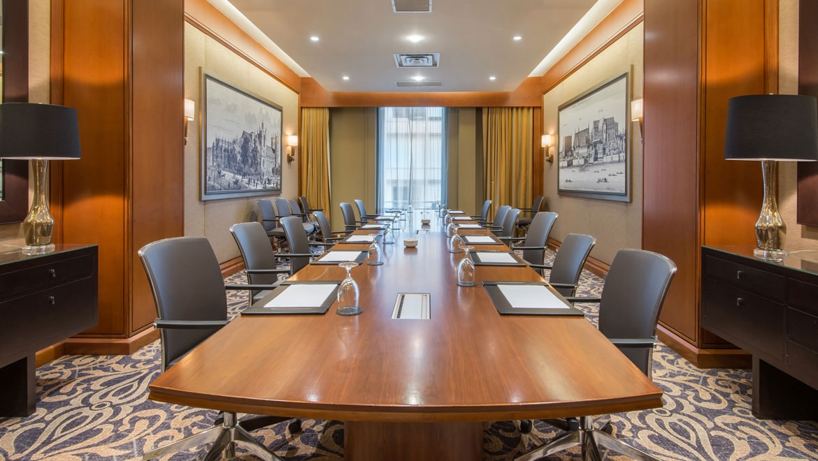 Boardroom with long table.